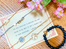 Load image into Gallery viewer, Joseph Campbell quote with 5 bracelets: one black with a turtle, one golden with a shape of the world, one golden spelling "love", one with a heart and a symbol for infinite, and one golden with white stones