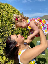 Load image into Gallery viewer, Woman looking at girl, holding her up, both of them wearing matching earrings
