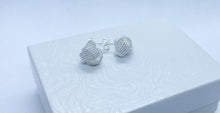 Load image into Gallery viewer, Knot silver earrings on top of white box
